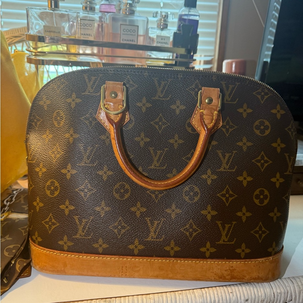 Authentic Louis Vuitton Brown Satchel with Iconic Monogram.